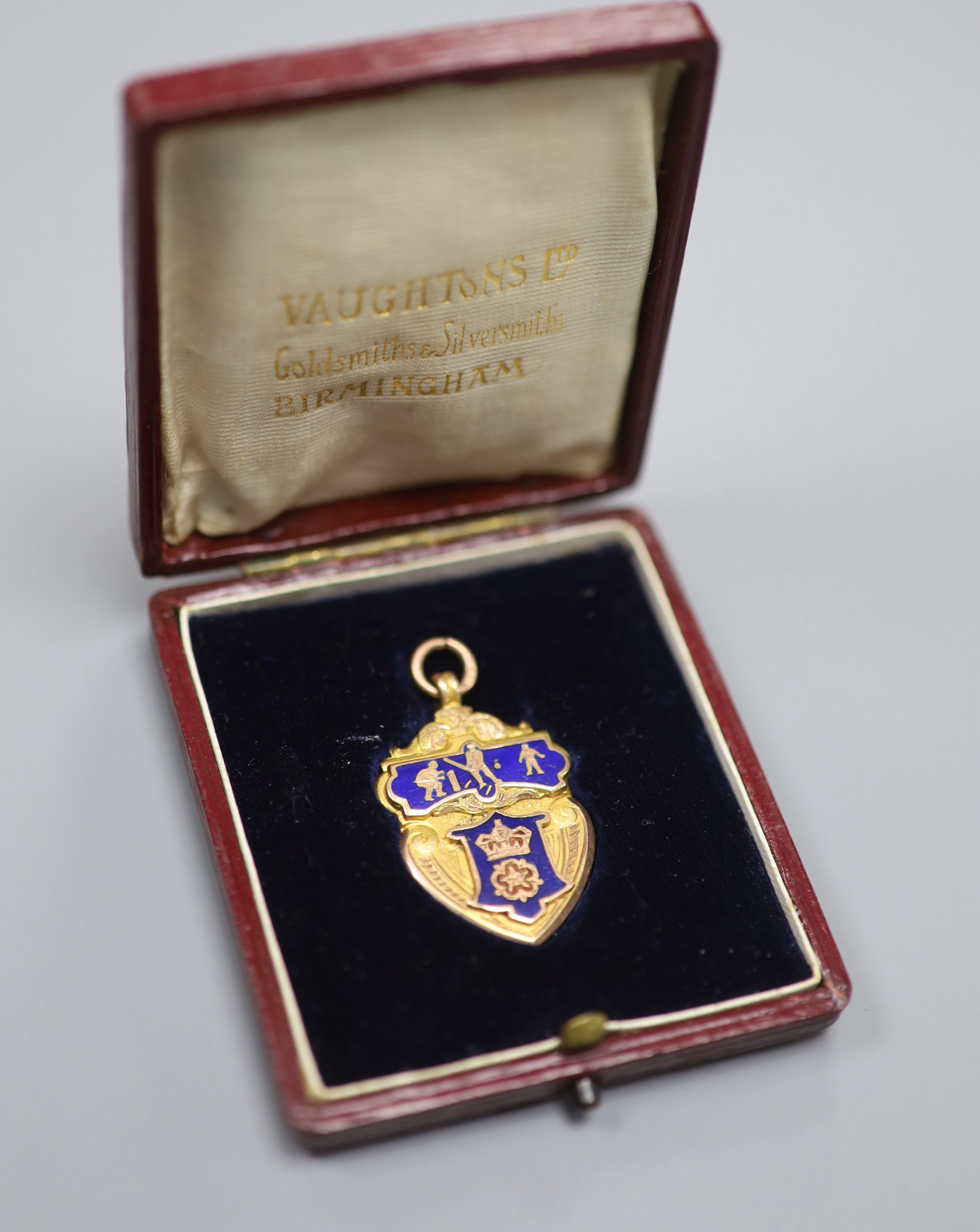 An Edwardian Derbyshire League 9ct gold and enamel cricket medal, Vaughton & Sons, Birmingham, 1909,